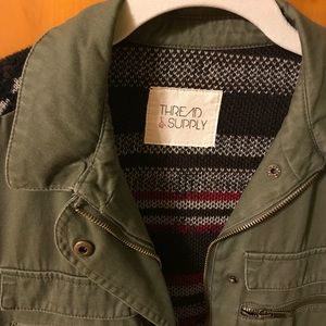 Army green , knit vest. Multi color back. M-L